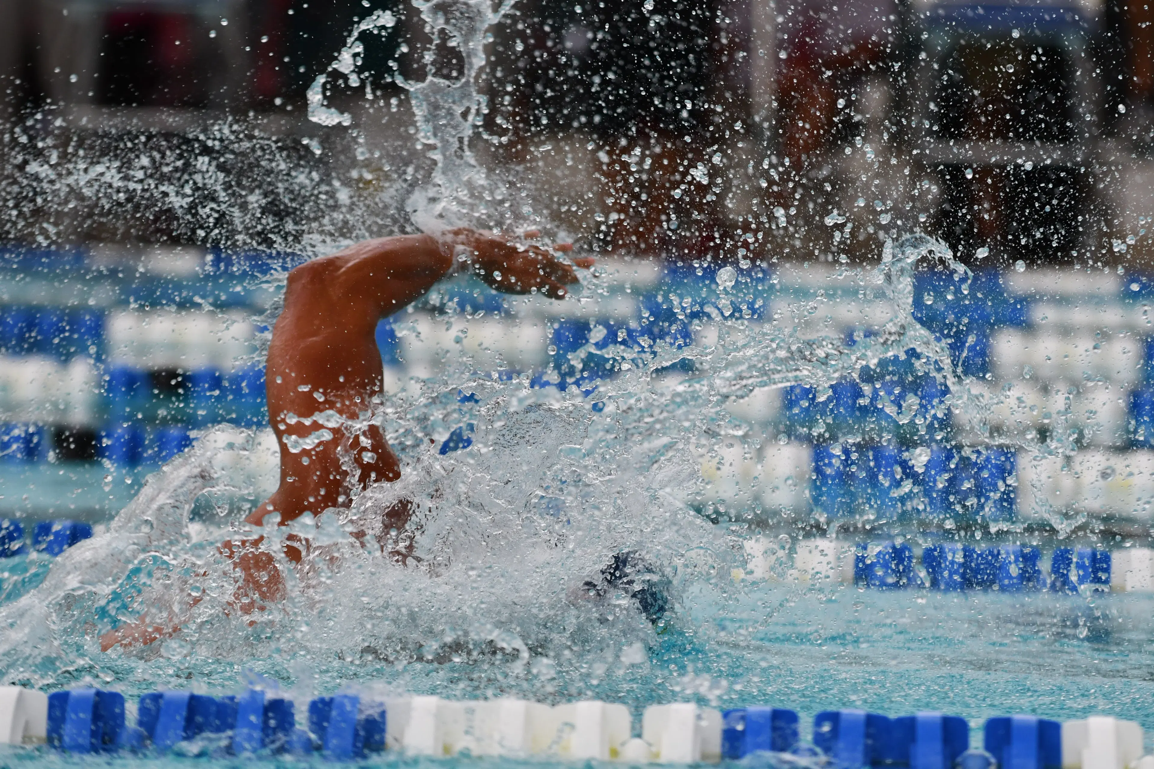 A swimmer working through a freestyle stroke