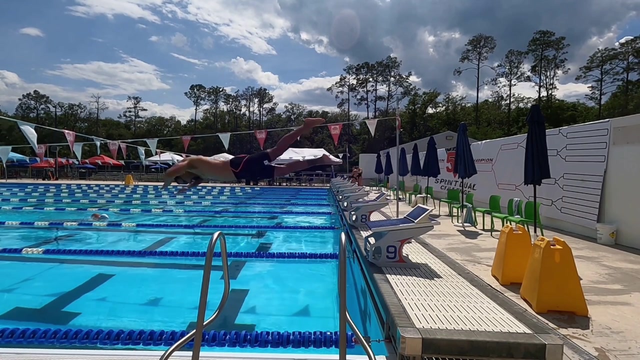 DRIVE source frame at 4.750 seconds in the forward swimming start.